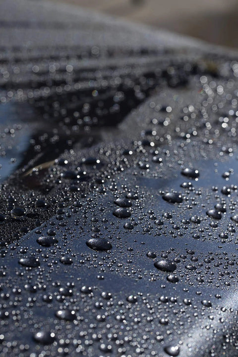 Water beading on car hood after using Touchless SiO2 Shield Sealant For Paint, Glass And Wheels, Water Activated, Spray On Rinse Off.