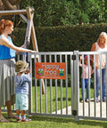 Straight Up Tough Top Pull Pool Safety Gate Latch With Audible Alarm Feature Keeps Kiddos Secure While Giving Homeowners Zero Hassle Installation And Weatherproof Year Round Guarding Black installed at a childcare facility.