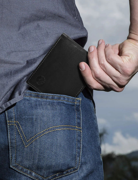 Man placing Men's Leather RFID Blocking Bifold Wallet For Everyday Carry And Daily Hustle in his back pocket