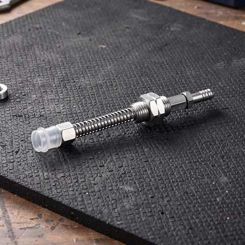 Heavy Duty M9 Threaded Pneumatic Suction Cup Holder With Spring Buffer For Robots on a textured black mat.