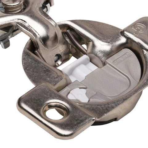 Close-up of a soft close cabinet hinge featuring a 45mm screw hole pattern, suitable for 1/2 inch overlay, made in USA.