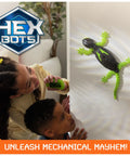 Children watch Wall Crawling Gecko Robot With Remote Control Realistic Creepy Crawly Action That Climbs Walls