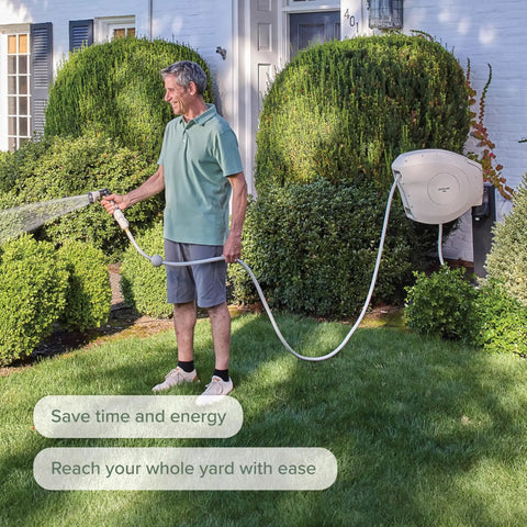 Man in garden using Beige 100 Foot Automatic Retractable Garden Hose Reel With One Half Inch UV Stabilized Kink Free Hose Wall Mounted Setup