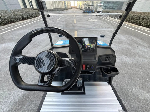 Kick Back In Style On This 2 Seat Electric Golf Cart Designed For Sightseeing And Leisure With Smooth MacPherson Strut Suspension 4KW Motor Advanced Disc Brakes And Huge Touchscreen Entertainment Setup - Interior view with steering wheel and touchscreen.