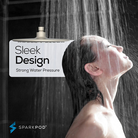 Woman enjoying water from 9.5 Inch Large Luxury Rain Shower Head For Full Body Coverage With High Pressure Flow, sleek design in brushed nickel.