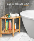 Corner Bamboo Shower Bench With Storage Shelf, 2 Tier Wood Seat, Non Slip Feet next to a bathtub with toiletries and towels