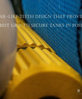 Close-up of yellow foam tube with gear teeth grips for Two Tank Scuba Cylinder Rack With Carrying Handle For Secure Storage And Easy Haul