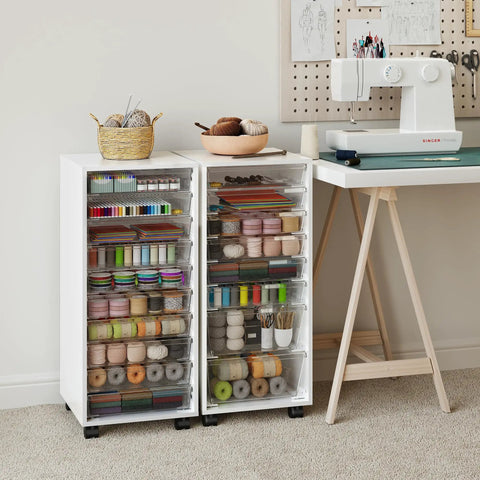 Rolling Storage Cart With 10 Large Clear Drawers, Mobile Makeup And Craft Organizer in white beside sewing table.