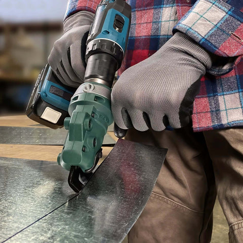 Close-up of Snapper Shear Drill Attachment cutting 18-gauge galvanized steel, showing 360-degree rotating head in use.