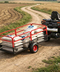 Beefed Up 1600Lb Steel Tow Behind Dump Trailer for ATVs hauling fertilizer on dirt path, 22 cu ft, all-terrain tires, removable sides