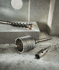 Bosch SDS-Max rotary hammer core bit set, 2-5/8 in x 22 in, with adapters on concrete surface