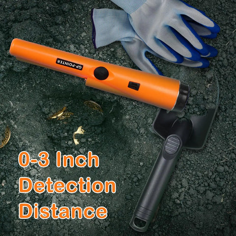 Treasure Hunting Kit With Metal Detector Pinpointer Sand Scoop Shovel Waterproof Gloves Finds Bag And Storage Pouch For Outdoor Treasure Hunting Adventures For Everyday Carry And More, showing pinpointer and shovel on soil with gloves.
