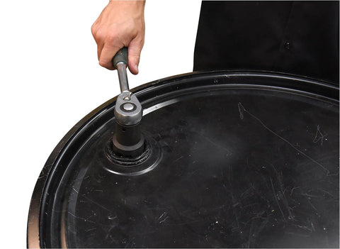 Hand using Chrome Vanadium Drum Impact Socket For One Half Inch Ratchet Drive Opens Two Inch And Three Quarter Inch Drum Plugs