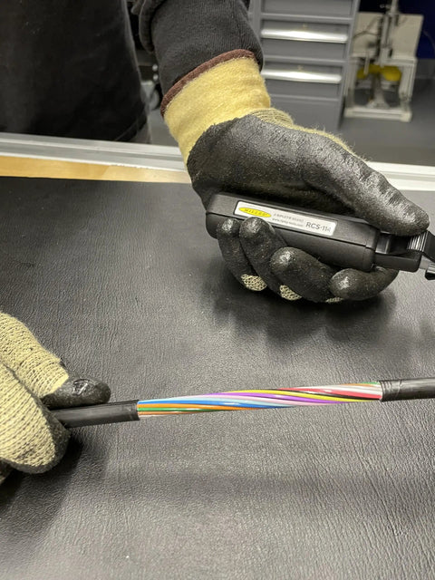 Technician using Hard Cable Jacket Strippers For Pros Portable Electrician Tool on multi-colored cables
