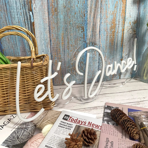 Lit Dance Neon Sign With Dimmer For Wall Decor, large LED neon light on wooden background with magazines and basket