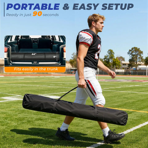 Man carrying a portable 6x6ft Football Throwing Net With Five Target Pockets in a black carry bag on a football field