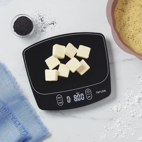 Waterproof Digital Kitchen Scale with 11 Pound Capacity Pro Grade Precision Ultra Accurate To 0.01 Oz And 1 Gram Tare Function Easy Clean Stainless Platform Ideal For Baking Cooking And Liquid Measurements displaying butter cubes