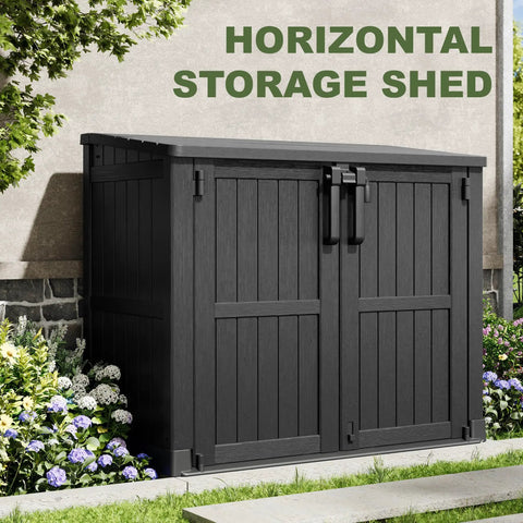 36 Cu Ft Weatherproof Outdoor Storage Cabinet With Dual Lockable Doors And Floor in a garden setting, black color.