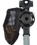 Front view of Hard Hitting Brass Catcher with Picatinny mount and heat resistant mesh attached to a rifle, catching brass casings.