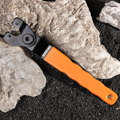 Universal Adjustable Pin Wrench For Angle Grinders And Power Tools With No Hassle Twist Knob Adjustment Heavy Duty Carbon Steel Spanner on rocks