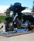 Blue Soft Tie Down Anchors For Ratchet Straps Two Pair Pack Smooth Operator Hookups securing a motorcycle on a trailer.