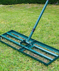 Heavy Duty Stainless Steel Lawn Leveler Rake With 30 By 10 Inch Ground Plate And 78 Inch Adjustable Handle on grass