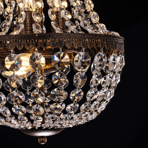 Close-up of a Six Light French Empire Crystal Chandelier with Antique Bronze Finish, 13 inch diameter, detailed crystal design