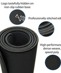 Close-up of rolled Massive 46 Inch Extended Gaming Mouse Pad Desk Mat With Stitched Edges Extra Thick 0.20 Inch Black Washable Surface