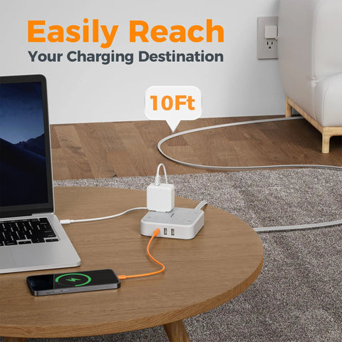 Extension Cord 10 Ft Long Surge Protector Power Strip With 4 Outlets 3 USB Ports Including USB C 900 Joules Protection Flat Cable For Home Office Dorm Room Desktop Charging Station Grey shown on a wooden table with devices charging.