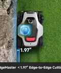 All Terrain Wire Free Robot Lawn Mower with AWD next to wall, demonstrating 1.97-inch edge-to-edge cutting capability.