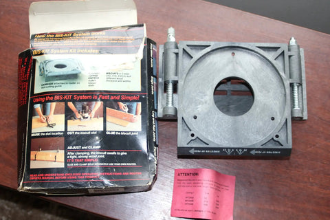 Step Up Your Shop Game With This Badass Biscuit Joiner Router Converter Kit next to its packaging and instructions on a wooden surface.