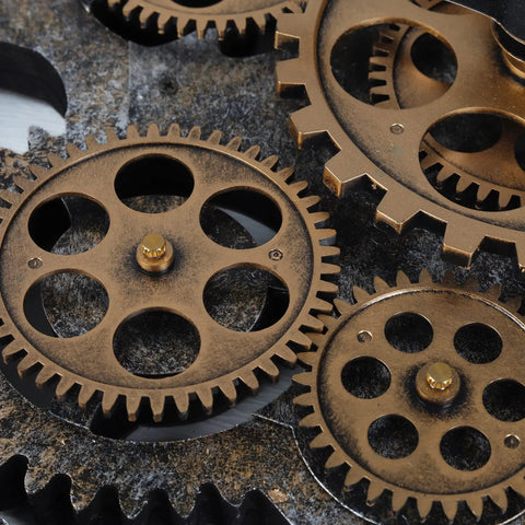 Close-up of bronze gears from Steampunk Wall Clock With Moving Bronze Gears And Rustic Wooden Frame Perfect For Farmhouse Decor.