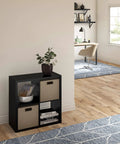 Open Back 4 Cube Storage Organizer In Black Built With A Sturdy Frame And Finished On Front And Back Perfect For Living Room Or Closet Organization Accepts 13 Inch Fabric Bins Easy Assembly, displayed in a modern living room setting.