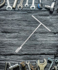 Heavy Duty T Handle Socket Wrench Set For Bike And Motorcycle Maintenance With Thick Hexagon Shaft and Slick No Slip Grip on a wooden surface.