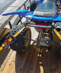 Heavy Duty Ratchet Tie Down Straps 4 Pack 16 Ft By 1.5 Inches securing an ATV on a trailer with rubber soft J hooks.