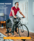 Person using Portable Foldable Fluid Bike Trainer Stand For Indoor Riding With Stainless Steel Frame Near Silent Flywheel
