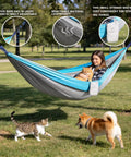 Woman relaxing in a Single Portable Parachute Nylon Hammock For Outdoor Adventure with a cat, showing hammock's durability and versatility.