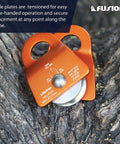 Close-up of Micro Aluminum Side Swing Pulley With Cheeks For Backyard Zipline And Trolley 20kN Single Pulley on tree