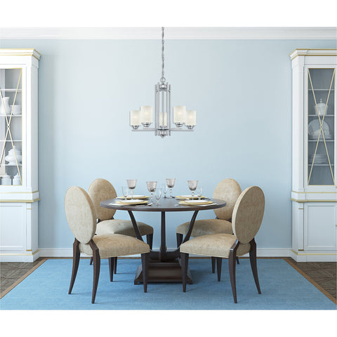 Dining area with Five Light Indoor Chandelier In Chrome With White Linen Glass Hansen Model, table and chairs underneath.