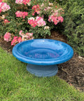 Fiber Clay Bird Bath With Gloss Azure Blue Bowl Grab And Go Low Profile Base 19 Inch Diameter in garden setting.
