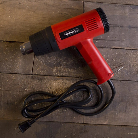 Dual Temperature 1500W Heat Gun Workhorse With 575 To 932 Degrees Fahrenheit Settings For DIY Projects Home Improvement And Contractors 120V Hot Air Tool for Paint Removal Vinyl Wrapping Shrink Tubing and More features red and black design with coiled cord on wood surface