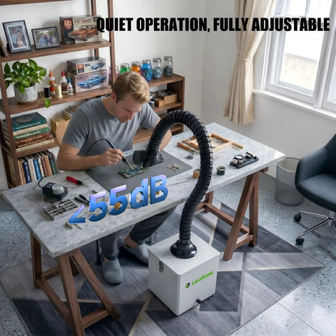 Person using 105W Solder Fume Extractor With Big 2 In 1 HEPA Carbon Filter For Soldering And PCB Repair in a workshop.