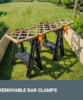 Clamping Sawhorses With Bar Clamps And A 7 Inch Metal Triangle Ruler For Precise DIY Woodworking outdoors on grass with clamps