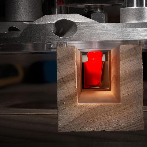 Three Quarter Inch Double Flute Straight Router Bit With One Quarter Inch Shank cutting a square hole in wood with CNC.