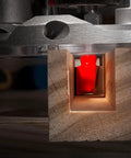 Top Shelf 11/16 Double Flute Straight Router Bit With 1/4 Shank High Density Carbide cutting through wood creating clean edges.