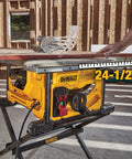 Compact Jobsite Table Saw with 24-1/2" cutting capacity and smooth rack and pinion fence in use at a worksite.