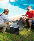 9 Gallon Outdoor Beverage Cooler With Insulated Ice Chest at poolside with easy lid, durable black design, weather resistant for gatherings