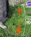Double Edged Serrated Grass Cutter With 8 Inch Steel Blade And 22 Inch Soft Rubber Handle in use, showing 80-inch cutting range