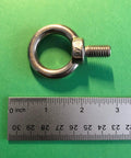 Dope Marine Grade Stainless Lifting Eye Bolt Three Eighths Inch UNC 316 for cables, heavy duty, rust resistant, on green background