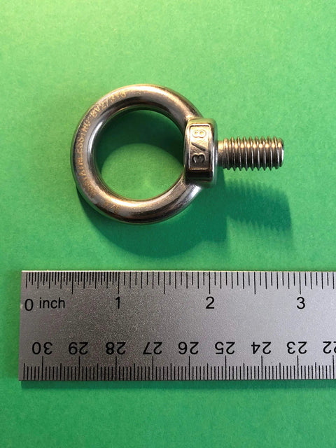 Dope Marine Grade Stainless Lifting Eye Bolt Three Eighths Inch UNC 316 for cables, heavy duty, rust resistant, on green background